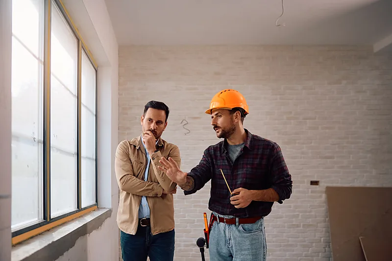 Estimator walking through a project with a homeowner